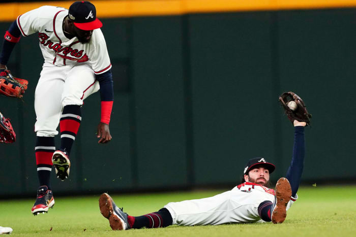 Dansby Swanson shows his glove after making an incredible diving catch.